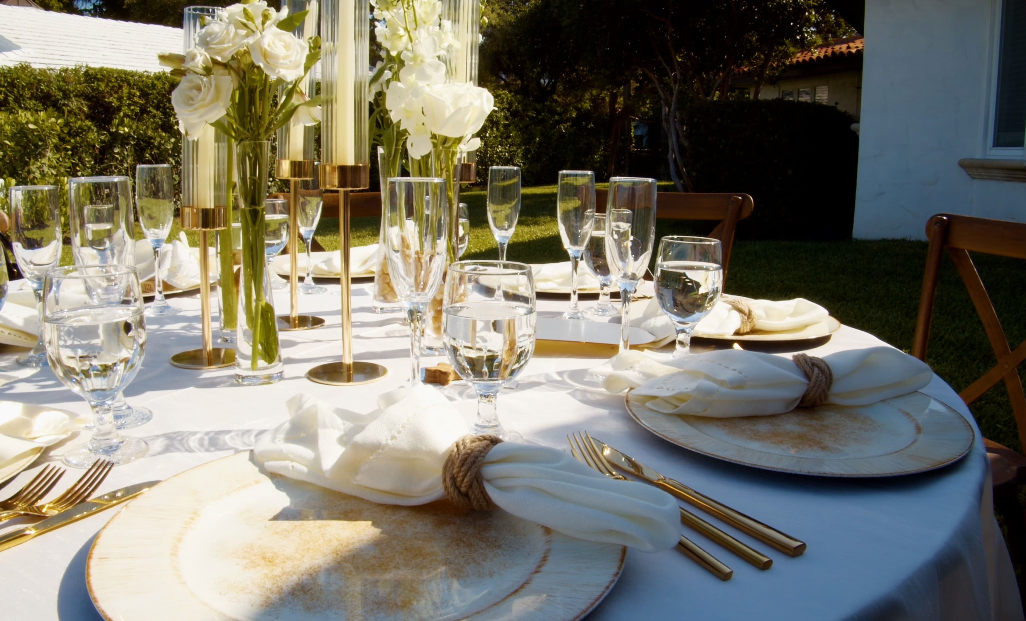 Outdoor tablescape with florals and dessert at a destination celebration