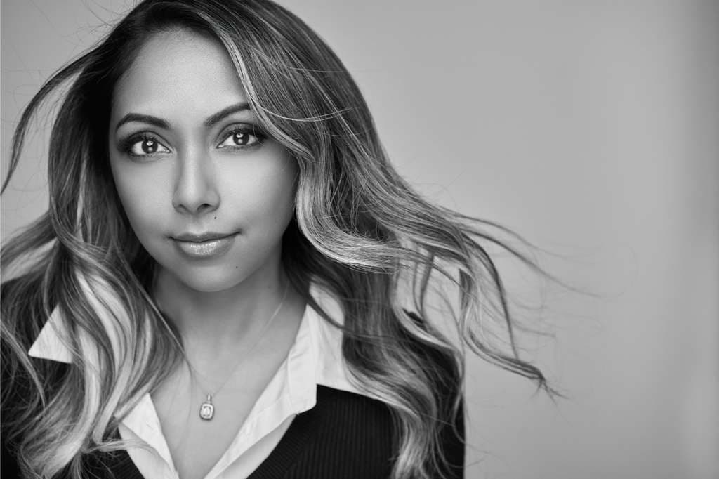 Black-and-white portrait of Kristi, curator of legendary celebrations